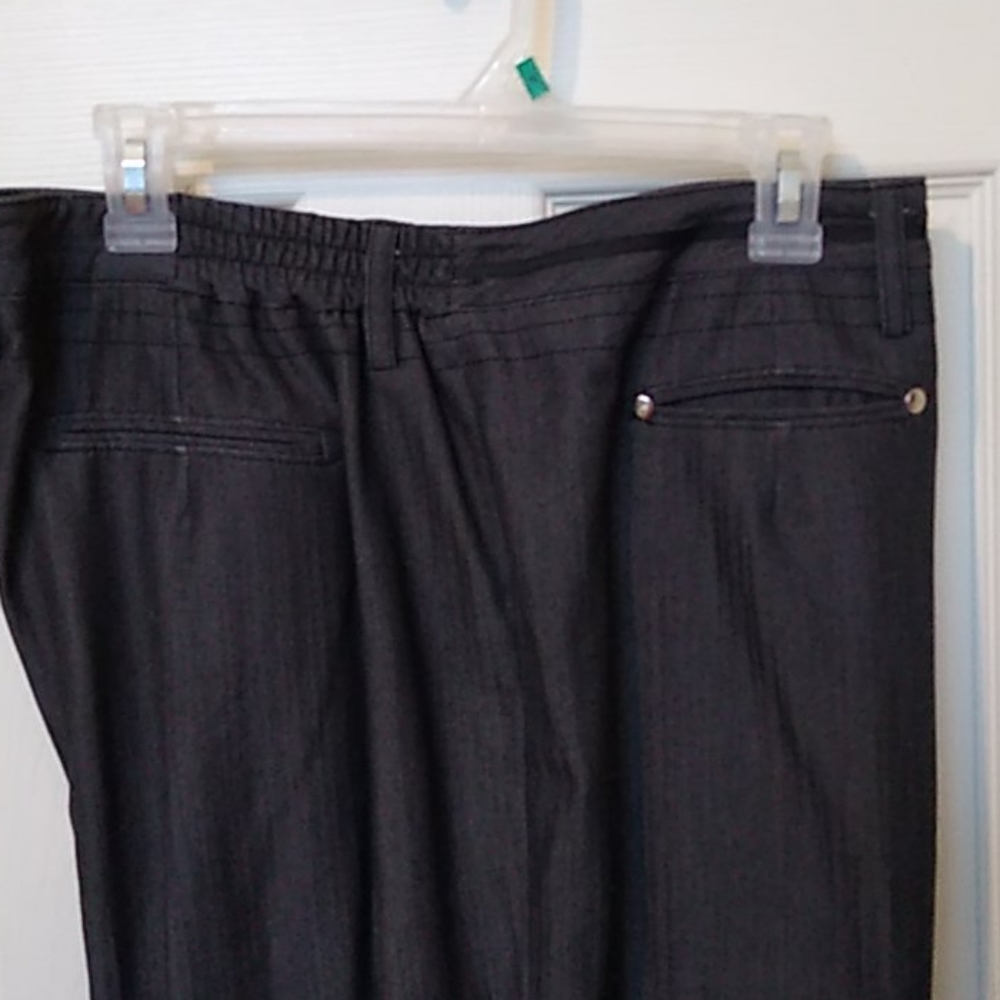 Cato black slacks/front pocket detailing.